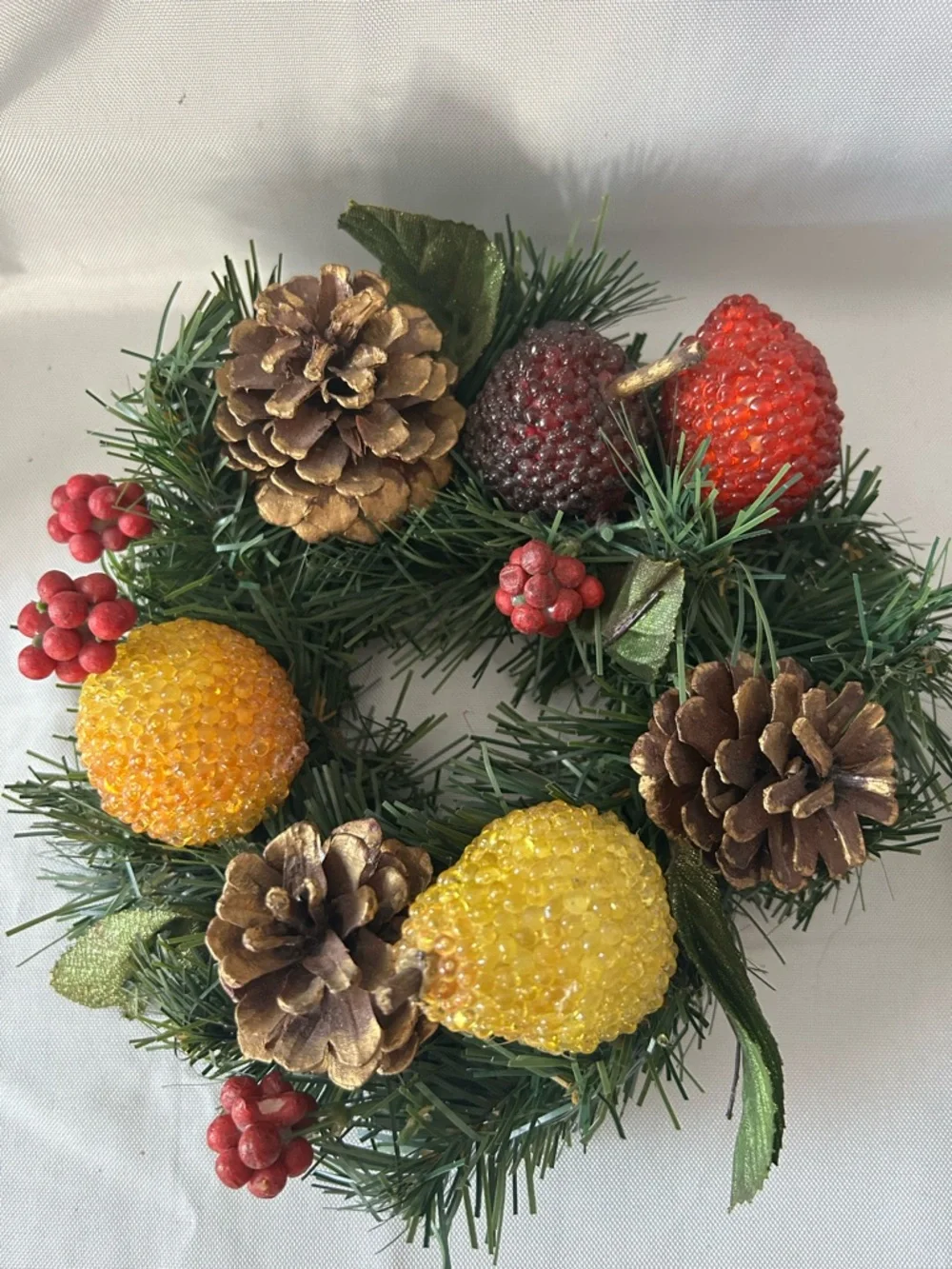 VTG artificial wreath/candle ring w/faux fruit, pinecones, and red berries.
